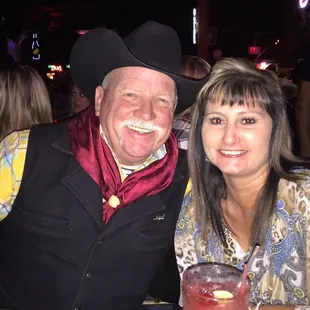 a man and a woman at a bar