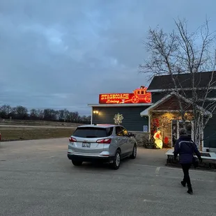 The neon sign which you can see from the road.