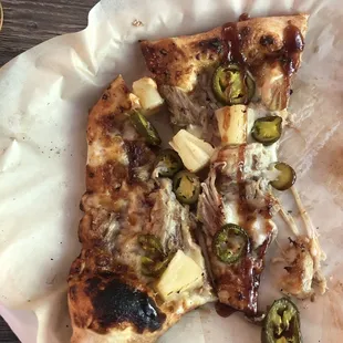 Sweet and spicy barbecue pizza. It comes with pulled pork, pineapple, spicy jalapeños, and North Carolina barbecue sauce.