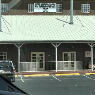 Signs on the building. Office is below.
