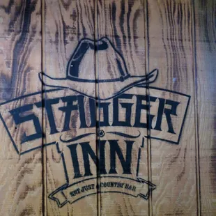 the logo on a wooden sign