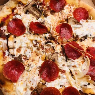 Pepperoni + Sausage Pizza, added shrooms and onions... spicy and delicious!