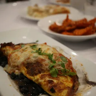 The Hombre Three egg omelette with black beans, fresh house made salsa, Monterey Jack cheese and chorizo sausage.