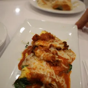 Omelet with grilled cheese, chicken, and spinach