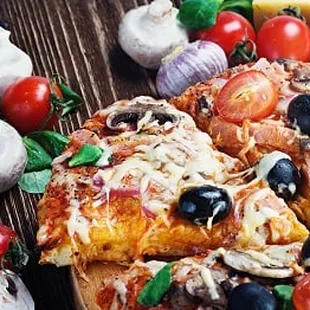 a slice of pizza on a cutting board