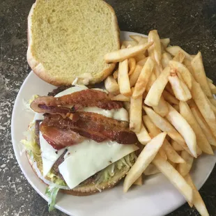 cheeseburger with french fries and bacon and american cheese