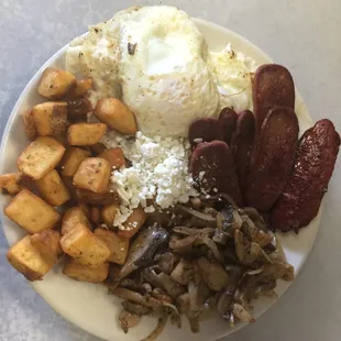 breakfast specialty plate with sunny side up eggs, home fries, mild and hot beef sausage and sauteed mushrooms and onions