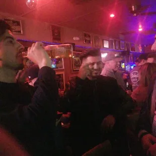 a group of men in a bar