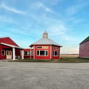 a red barn with a clock tower