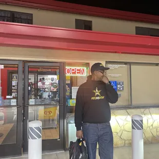 The Mr in front of the general store/chevron