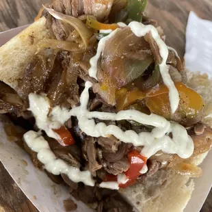 a sandwich with meat and vegetables