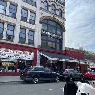 a teddy bear in front of a building