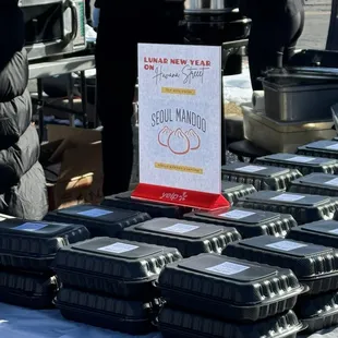 a table full of containers of food
