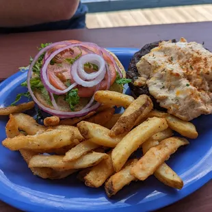Burger with crab dip on top and side of fries