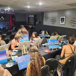 a group of people painting