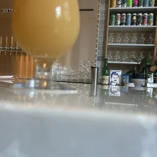 The name is above the beer