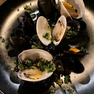Squid ink risotto with mussels and clams