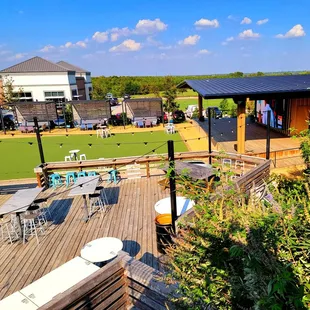 Outdoor deck seating, stage &amp; Jumbo screen on right. Firepit Row in back.