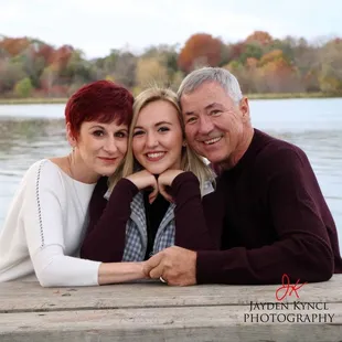 Family photos at the picnic bench by the water