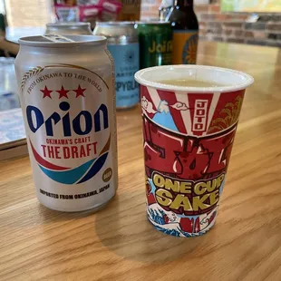 a drink and a can of priion