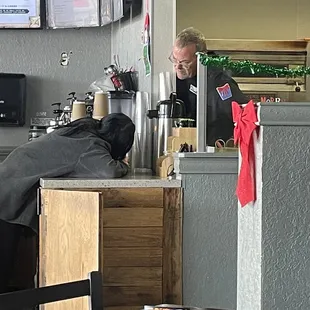 a man working in a coffee shop