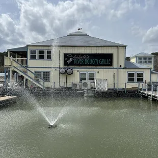 a fountain in front of the restaurant
