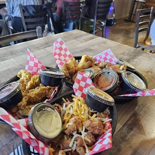 Fried gator tail, fried oyster and chicken wings.
