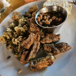 Pork tenderloin bites with wild rice and baked beans