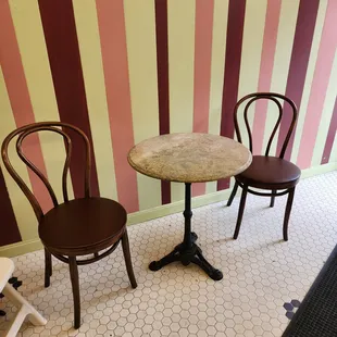 These are supposedly the chairs and tables used in the movie.  Right by the entrance, not by the window (no big deal)...