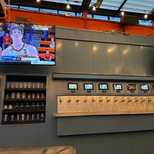 a large screen tv and a beer dispenser