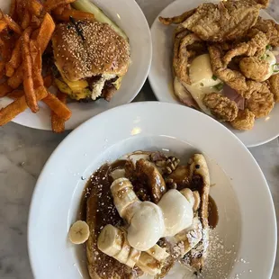 two plates of food on a marble table