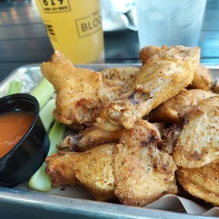 Dry rub Bone-in wings with Mango Habanero on the side. Summer Shandy on Tap.