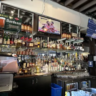 a bar with a variety of liquors