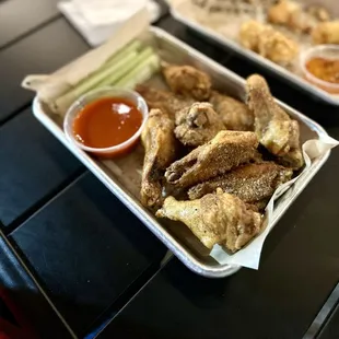 Dry rub wings with a side of buffalo sauce