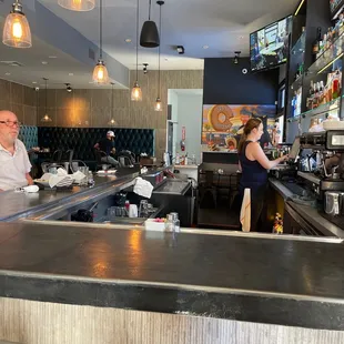 a man and a woman at the bar