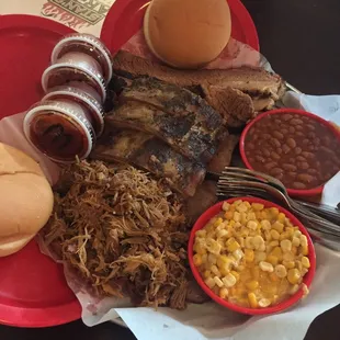 Who&apos;s Your Daddy: pulled pork, sausage, ribs, brisket, two sides, two buns