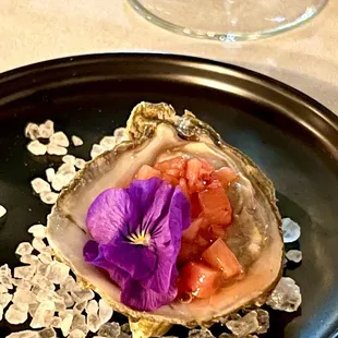 Raw oyster with strawberry Minette and edible flour. Super tasty!