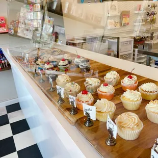 a variety of cupcakes on display