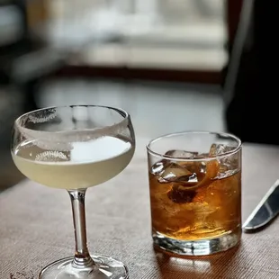 two cocktails on a table