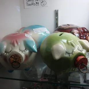 A herd of Hall pottery pigs in a case by the front door.