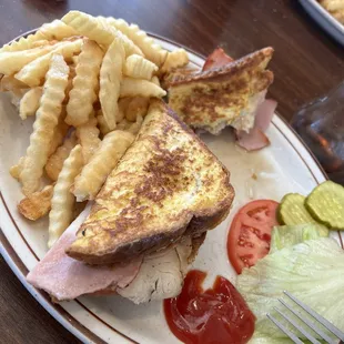 Monte Cristo Sandwich with side of fries.