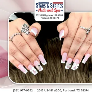 Add a touch of elegance with white tip nails and rhinestone accents--simple, chic, and totally glam!