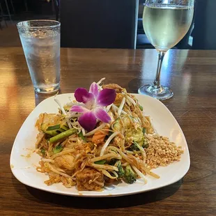a plate of food and a glass of water