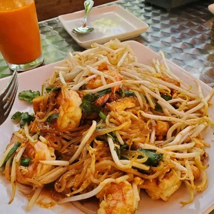 Pad Thai with shrjmp...I&apos;m td it was good. The orangey drink is iced tea....weird color but my friends asked for more milk, and were happy.