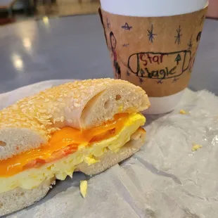 Early Bird bagel (without Swiss cheese) on a sesame bagel and a drip coffee.