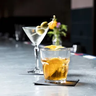 a glass of alcohol and a martini