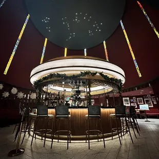 a circular bar with stained glass windows