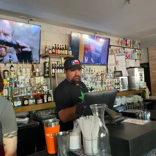 two men behind the bar