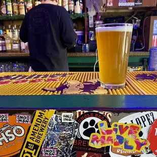 a pint of beer on the bar