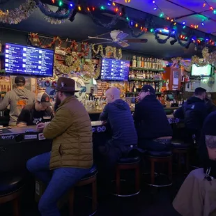 people sitting at the bar